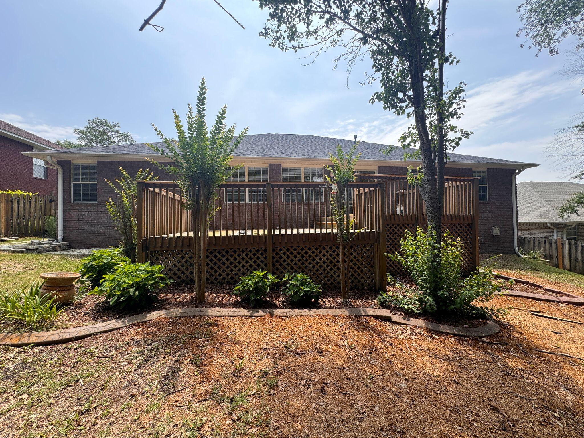 516 Vulpes Sanctuary Loop Crestview, FL 32536 - Photo 28 of 30 a front view of a house having yard