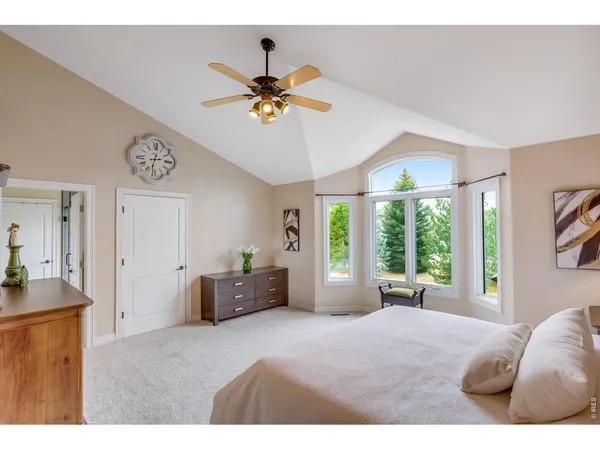 a spacious bathroom with a double vanity sink a large mirror a bathtub and shower