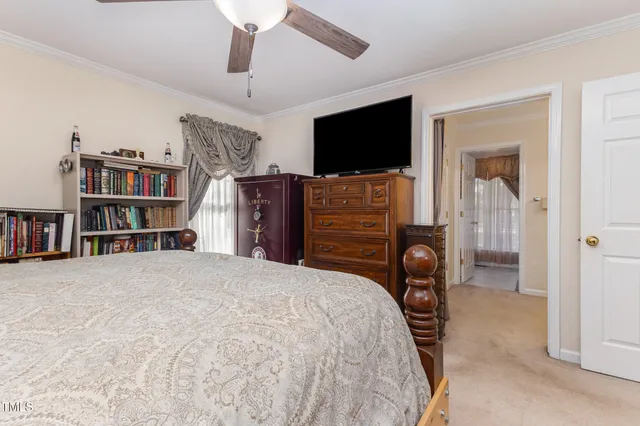 a kitchen with white cabinets sink and appliances