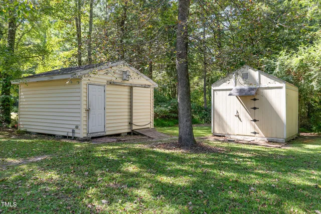 a view of two chairs in the balcony