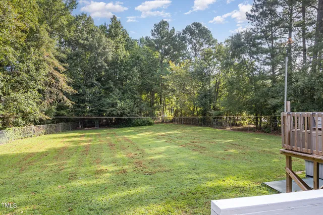 a house with trees in the background