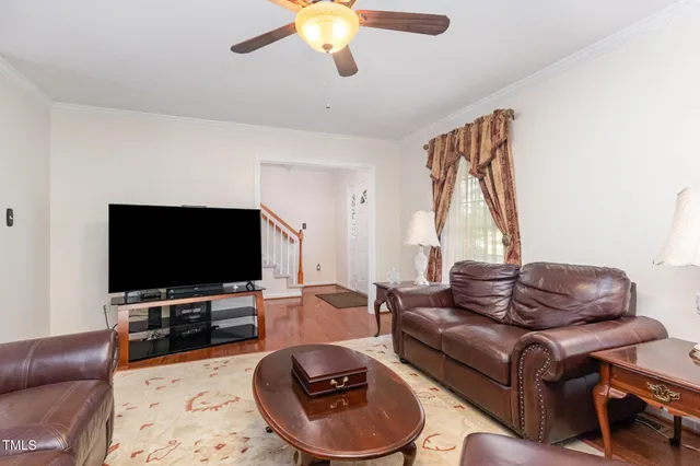 a view of balcony with wooden floor and fence