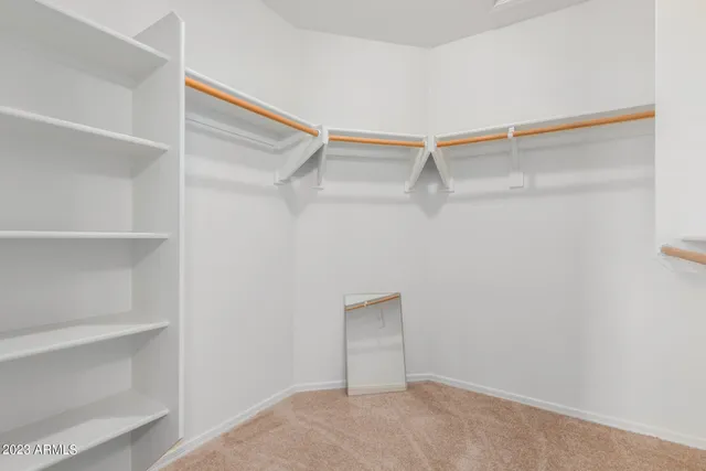 a view of an empty walk in closet
