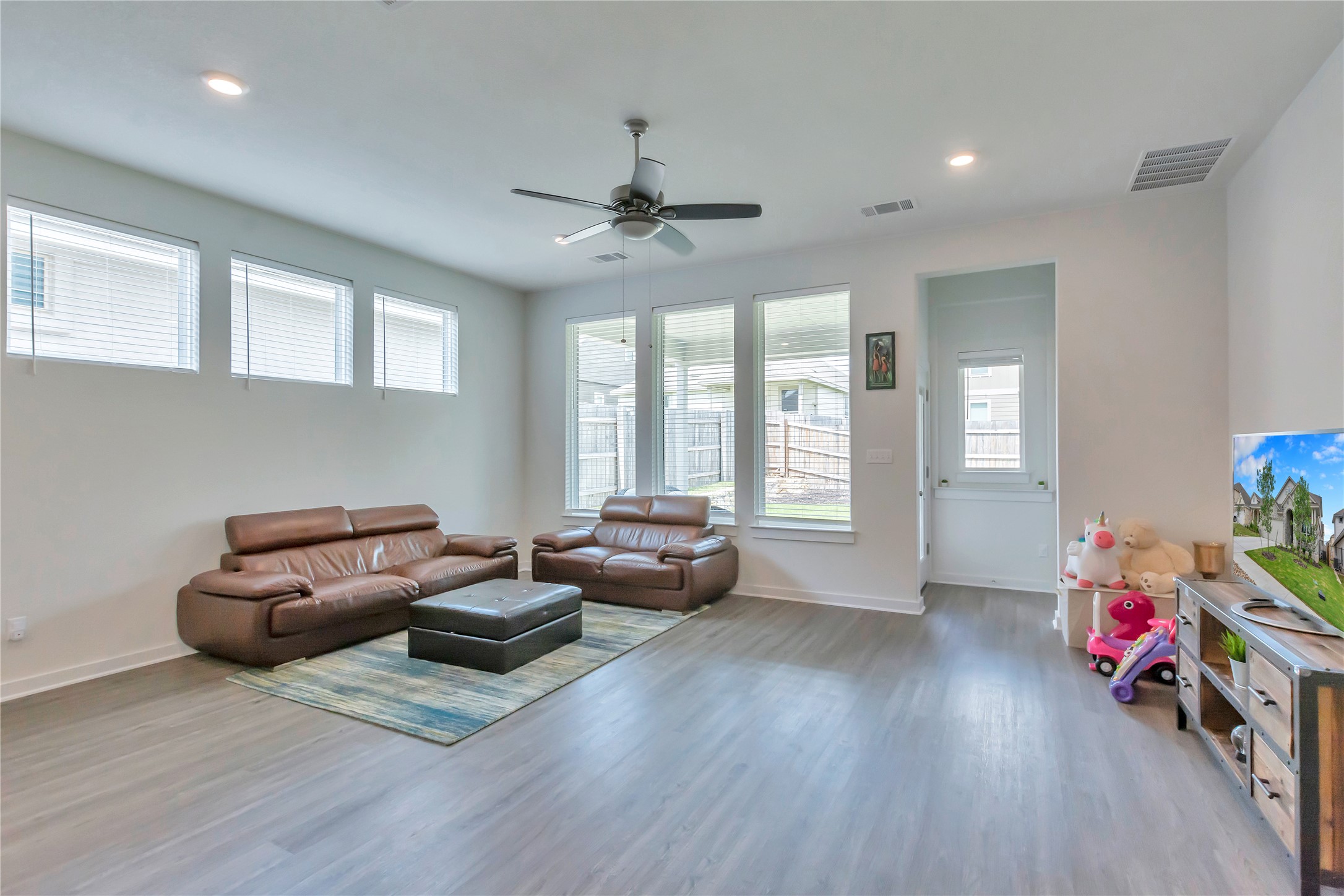 563 Saturnia Drive Georgetown, TX 78628 - Photo 9 of 29 a living room with furniture and a wooden floor