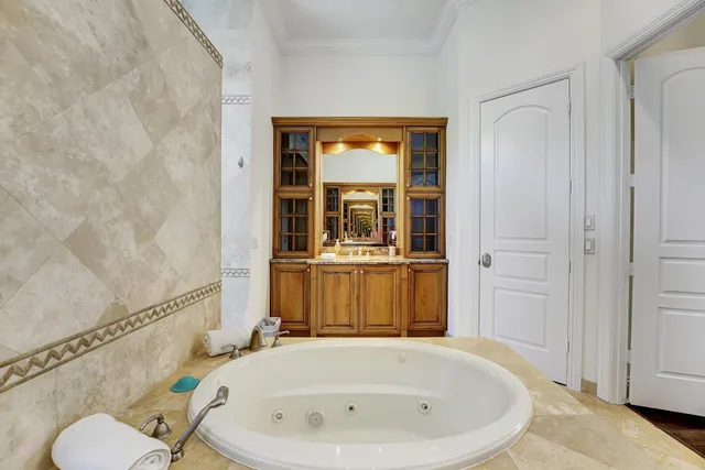 a view of a bathroom with a sink and a mirror
