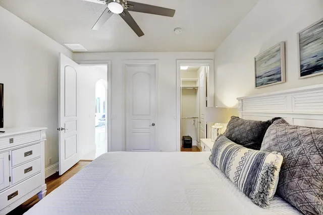 a bedroom with a bed and a dresser