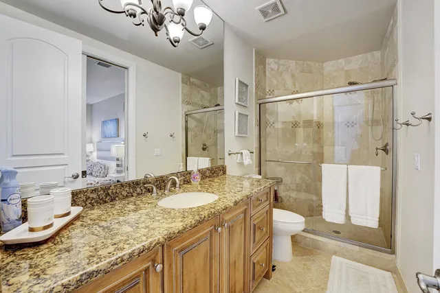 a bedroom with a bed and painting on the wall