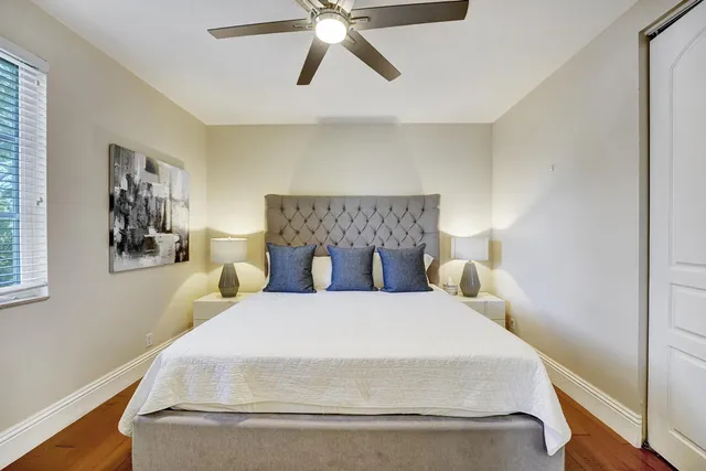 a en suite bathroom with a granite countertop sink and a mirror
