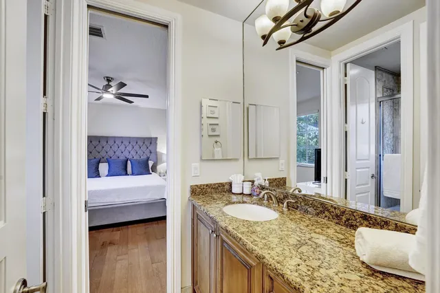 a bedroom with furniture and a window