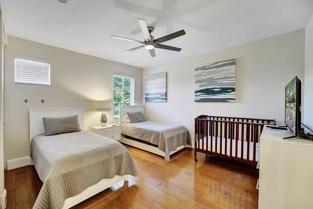 an aerial view of a house with yard