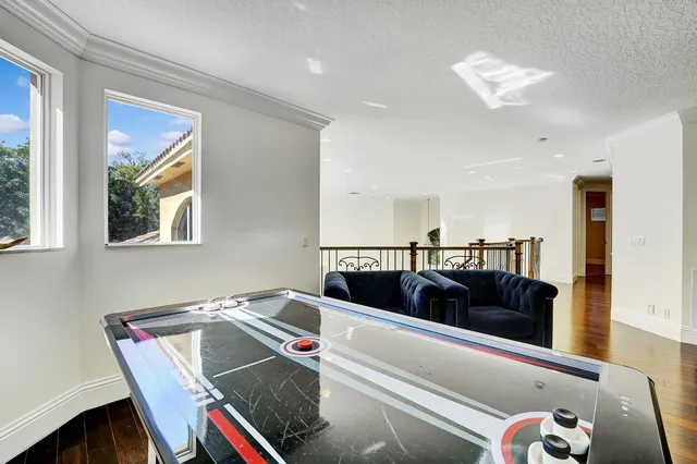 a view of a house with a backyard and a patio