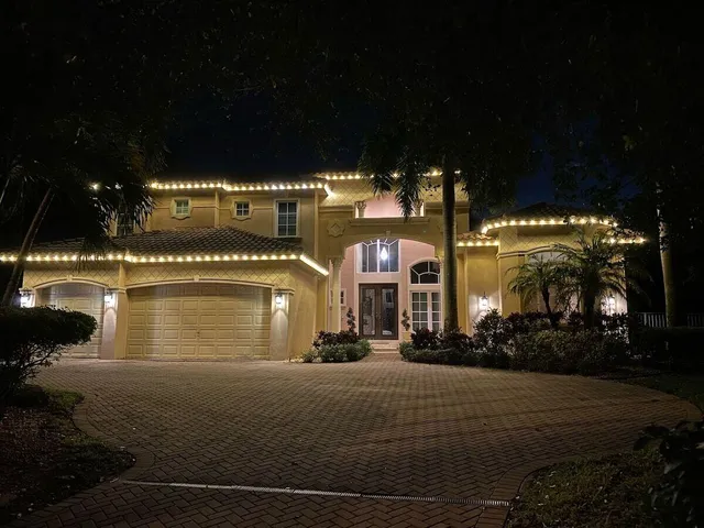 a view of a street with a building and trees in the background