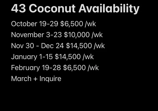 a large white kitchen with lots of counter space and windows