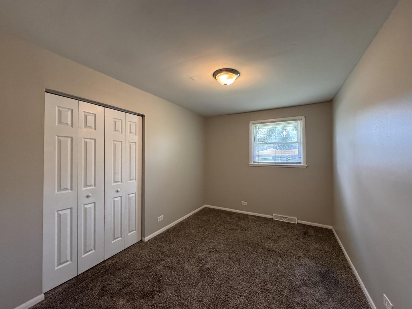 3312 Maple Lane Hazel Crest, IL 60429 - Photo 13 of 27 an empty room with a empty space and windows