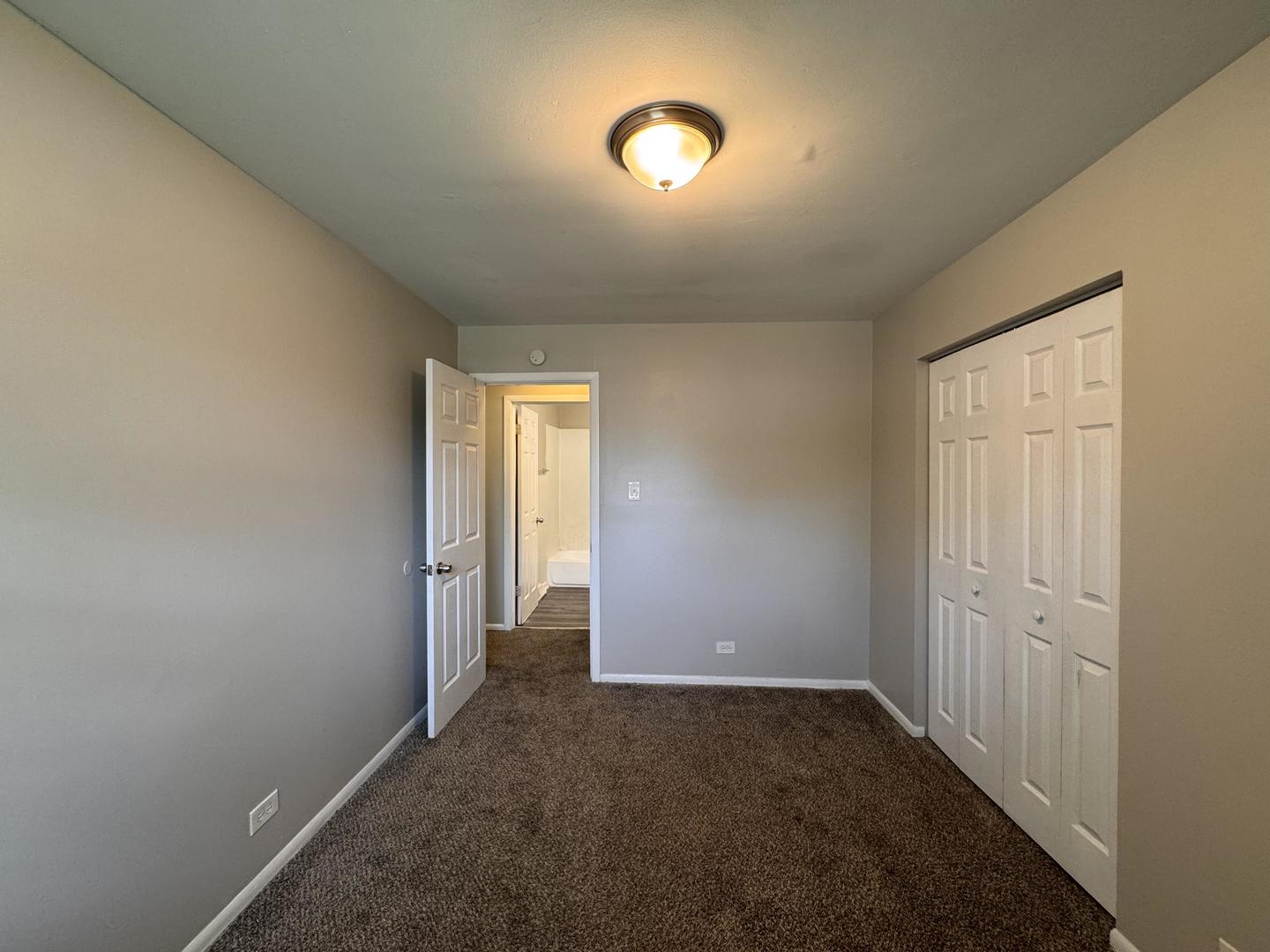 3312 Maple Lane Hazel Crest, IL 60429 - Photo 17 of 27 an empty room with windows and entrance