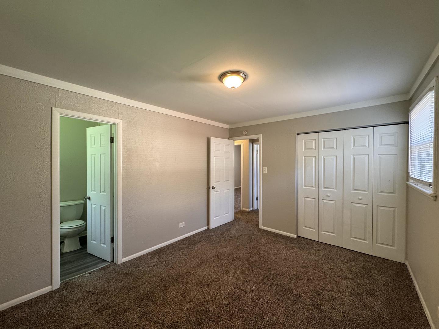 3312 Maple Lane Hazel Crest, IL 60429 - Photo 20 of 27 an empty room with closet and a bathroom