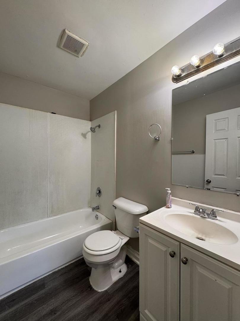 3312 Maple Lane Hazel Crest, IL 60429 - Photo 22 of 27 a bathroom with a sink a toilet and shower