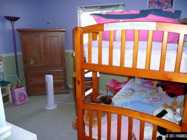1810 Stardust Street Reno, NV 89503 - Photo 11 of 13 a bedroom with furniture and a window