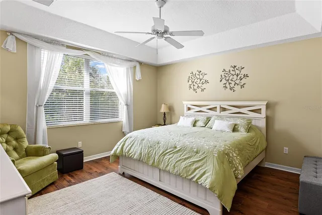 a bedroom with a bed and a couch