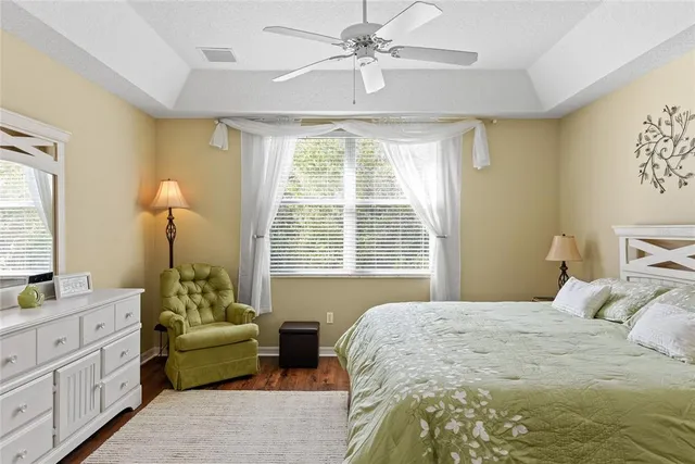 a bedroom with a bed and a couch