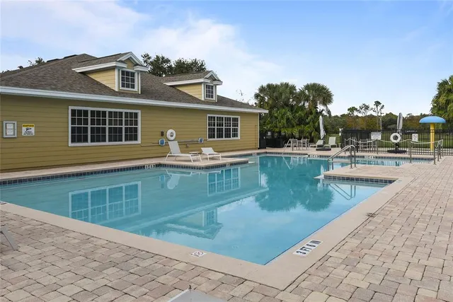 a front view of a house with swimming pool