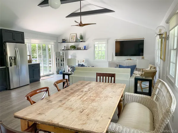 a living room with fireplace furniture and a flat screen tv