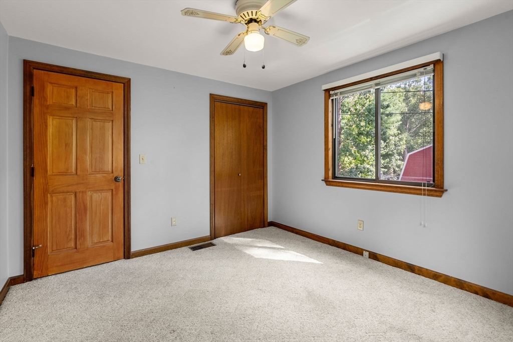 6 Jerry Road Sturbridge, MA 01566 - Photo 16 of 37 a view of an empty room with window and closet area