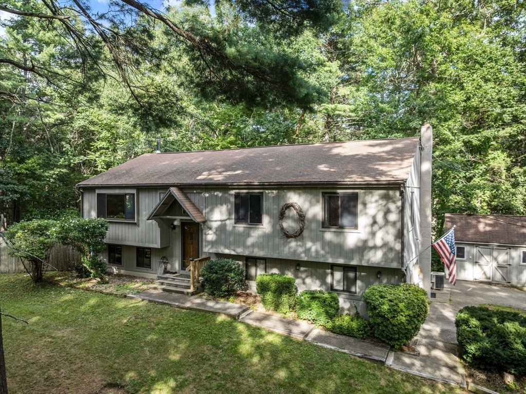 6 Jerry Road Sturbridge, MA 01566 - Photo 2 of 37 a front view of a house with a yard
