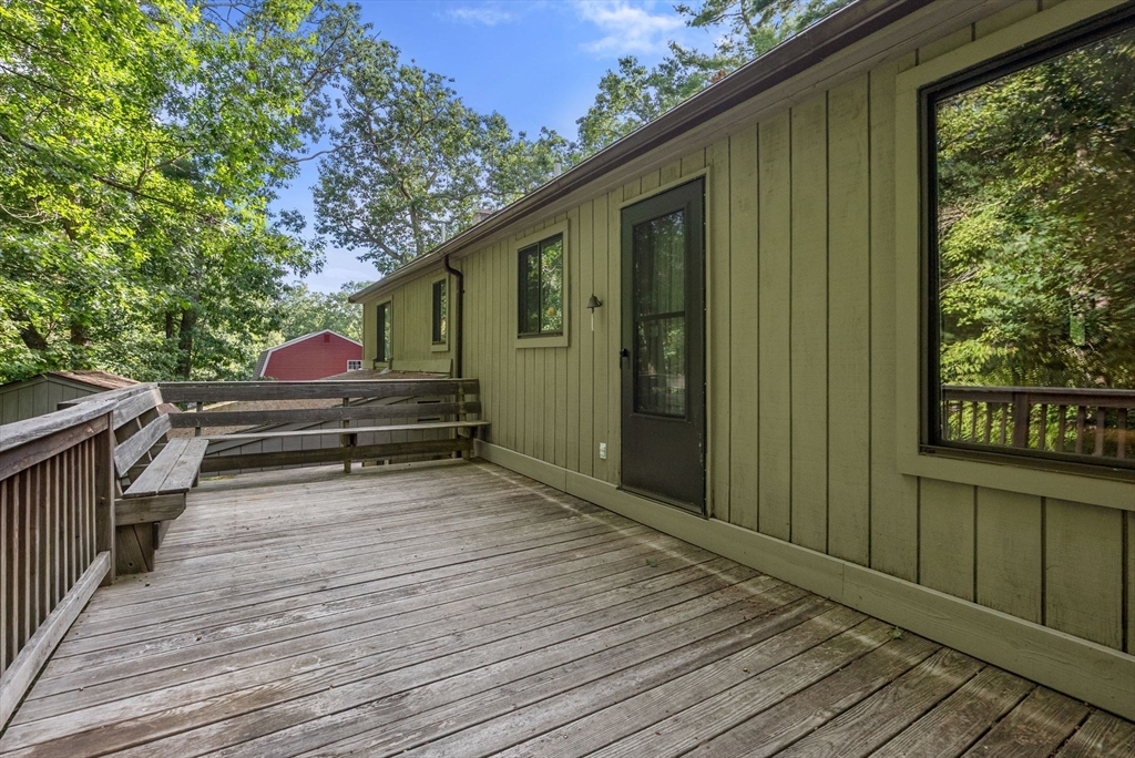 6 Jerry Road Sturbridge, MA 01566 - Photo 26 of 37 a backyard of a house with wooden floor and outdoor seating