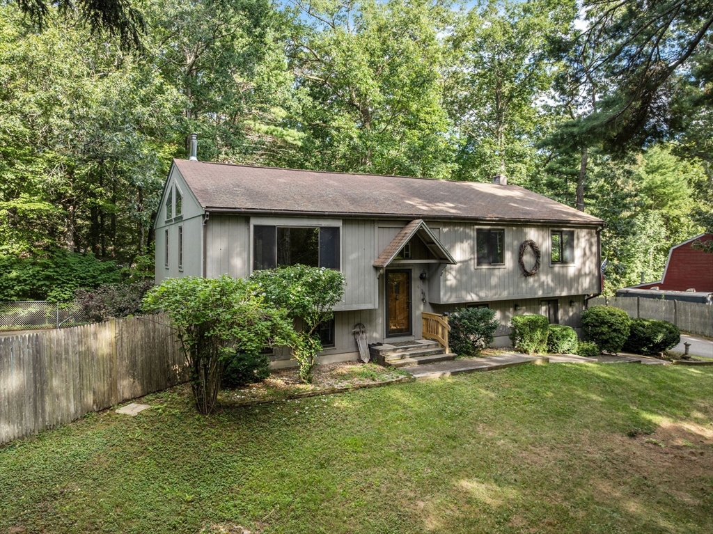 6 Jerry Road Sturbridge, MA 01566 - Photo 3 of 37 a front view of a house with a yard table and chairs