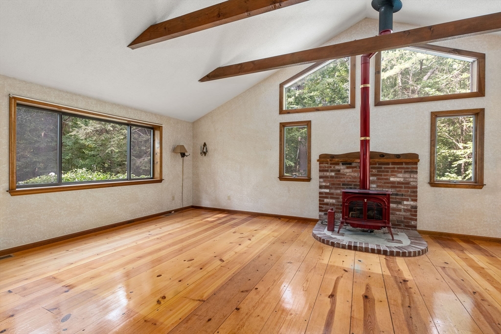 6 Jerry Road Sturbridge, MA 01566 - Photo 5 of 37 a view of an empty room with window wooden floor and brick walls