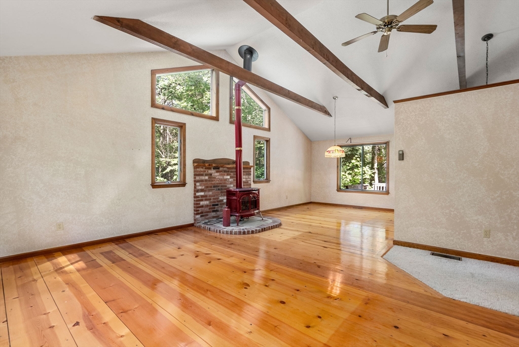 6 Jerry Road Sturbridge, MA 01566 - Photo 6 of 37 a view of an empty room with a window and a fireplace