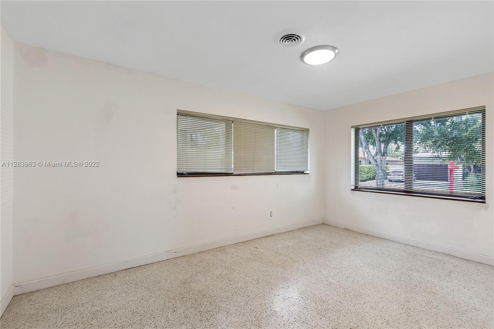 12906 Cherry Road North Miami, FL 33181 - Photo 17 of 20 an empty room with a window