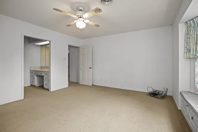 an empty room with a bathroom