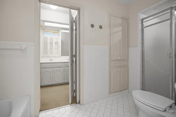 a bathroom with a toilet and a sink
