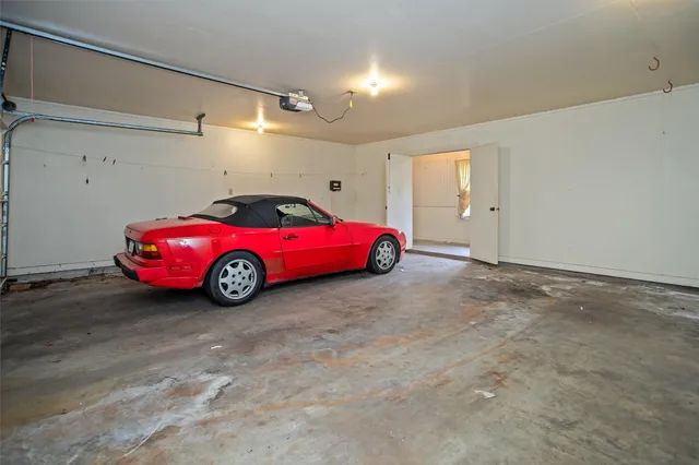 a view of an empty room and a window