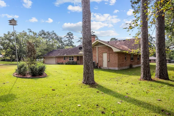 a view of a house with a backyard