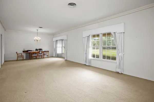 a view of a livingroom with furniture and a window