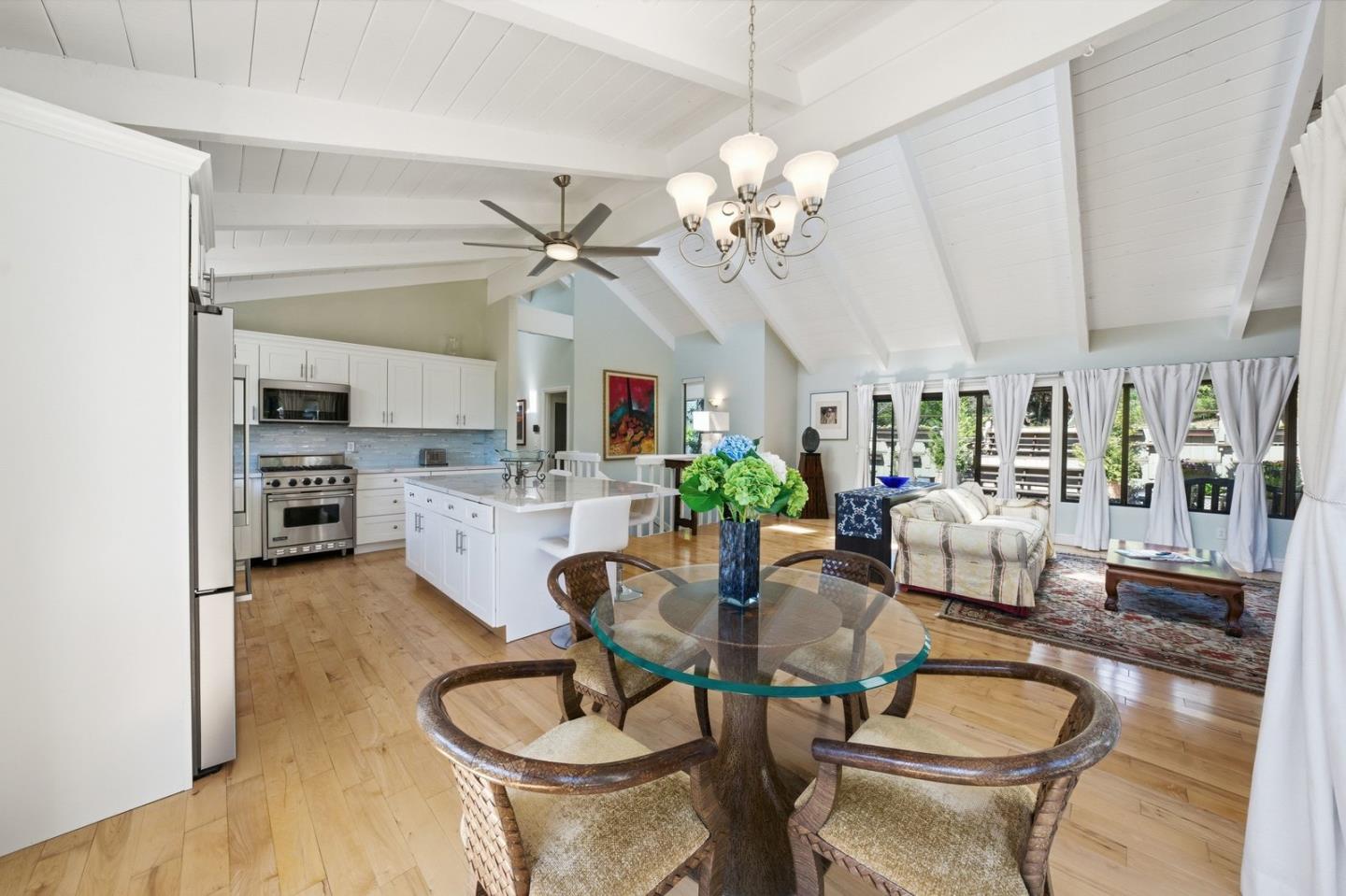 701 Day Valley Road Aptos, CA 95003 - Photo 10 of 43 a living room with fireplace furniture and a chandelier