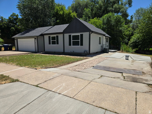 259 14th Street Ogden, UT 84404 - Photo 2 of 21 Single-story residence featuring a two-tone exterior, dark shingle roof, and attached garage