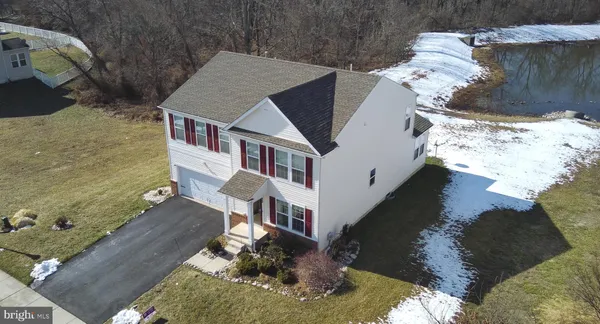 a aerial view of a house with a yard