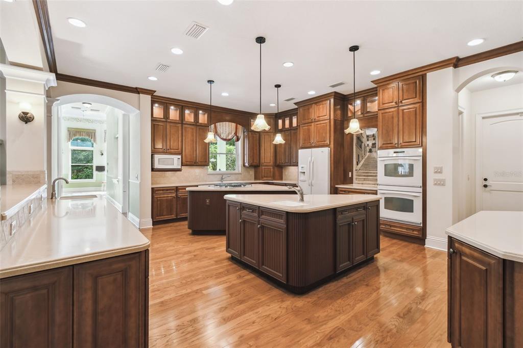 1745 Taylor Woods Road DeLand, FL 32724 - Photo 13 of 66 a kitchen with stainless steel appliances granite countertop a stove and a refrigerator