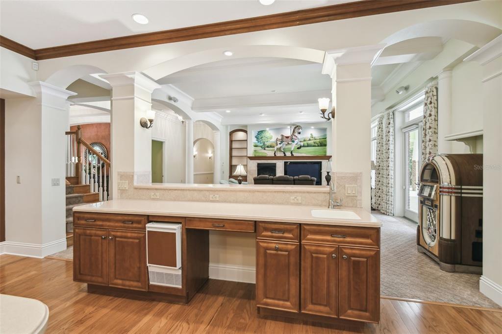 1745 Taylor Woods Road DeLand, FL 32724 - Photo 15 of 66 a kitchen with stainless steel appliances granite countertop a stove a sink and a refrigerator