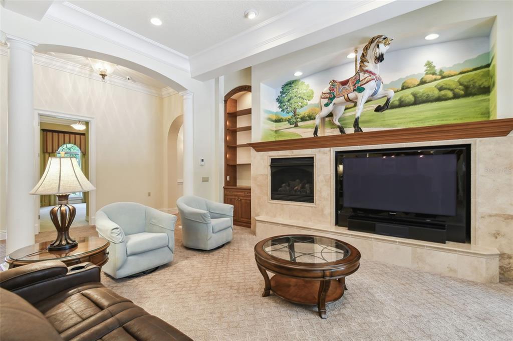 1745 Taylor Woods Road DeLand, FL 32724 - Photo 20 of 66 a living room with furniture a window and a flat screen tv