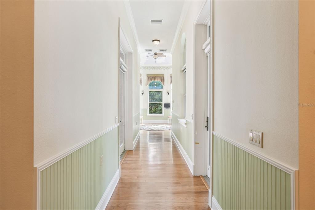 1745 Taylor Woods Road DeLand, FL 32724 - Photo 23 of 66 a view of a hallway with wooden floor and staircase