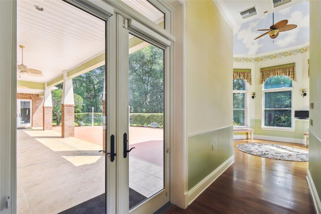 1745 Taylor Woods Road DeLand, FL 32724 - Photo 26 of 66 a view of an entryway with wooden floor and windows
