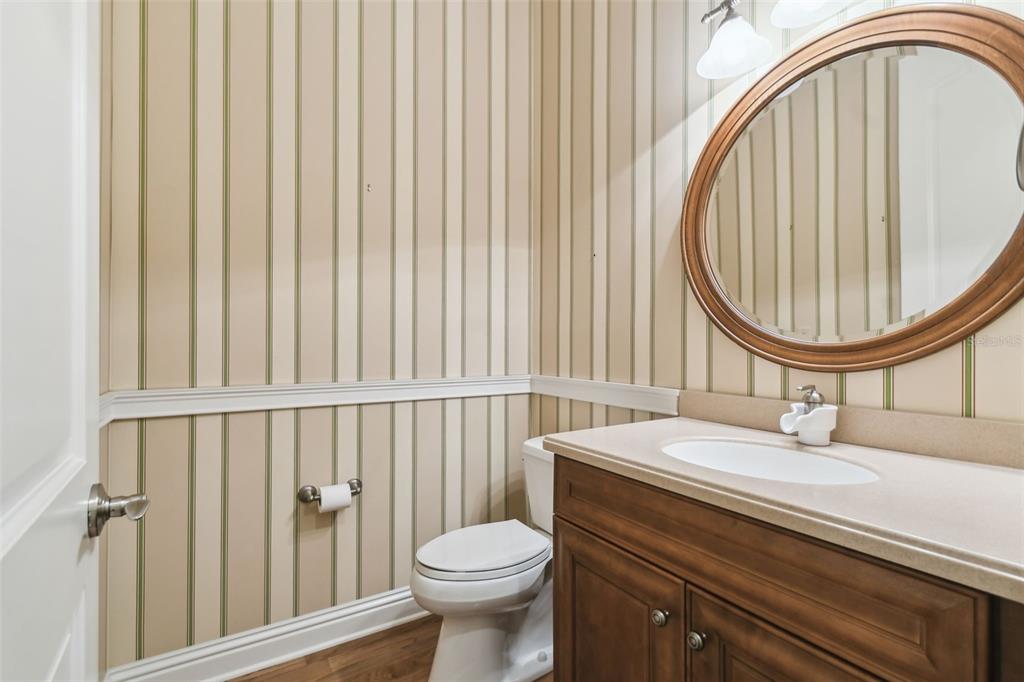 1745 Taylor Woods Road DeLand, FL 32724 - Photo 29 of 66 a bathroom with a sink a toilet and a mirror