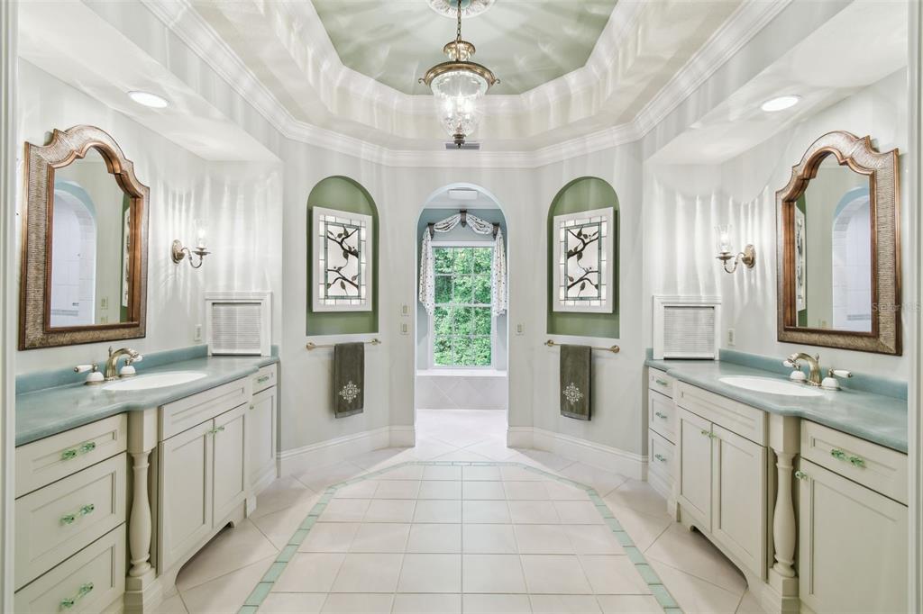 1745 Taylor Woods Road DeLand, FL 32724 - Photo 41 of 66 a spacious bathroom with a granite countertop double vanity sink and a mirror