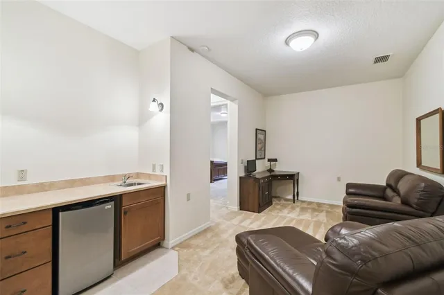 a view of a backyard with swimming pool and a yard