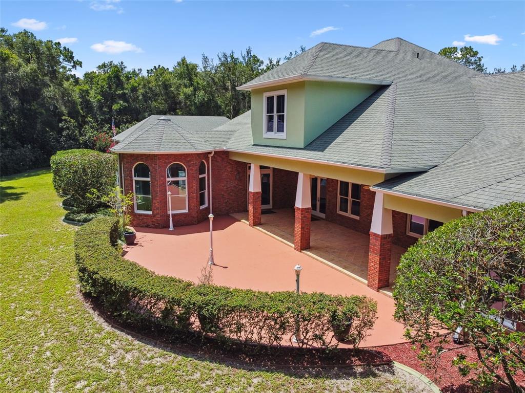 1745 Taylor Woods Road DeLand, FL 32724 - Photo 56 of 66 front view of a house with a yard
